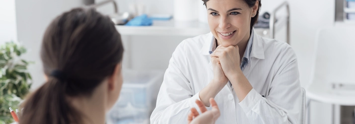 Professional consultation in an eye care clinic, discussing vision needs and treatment options.